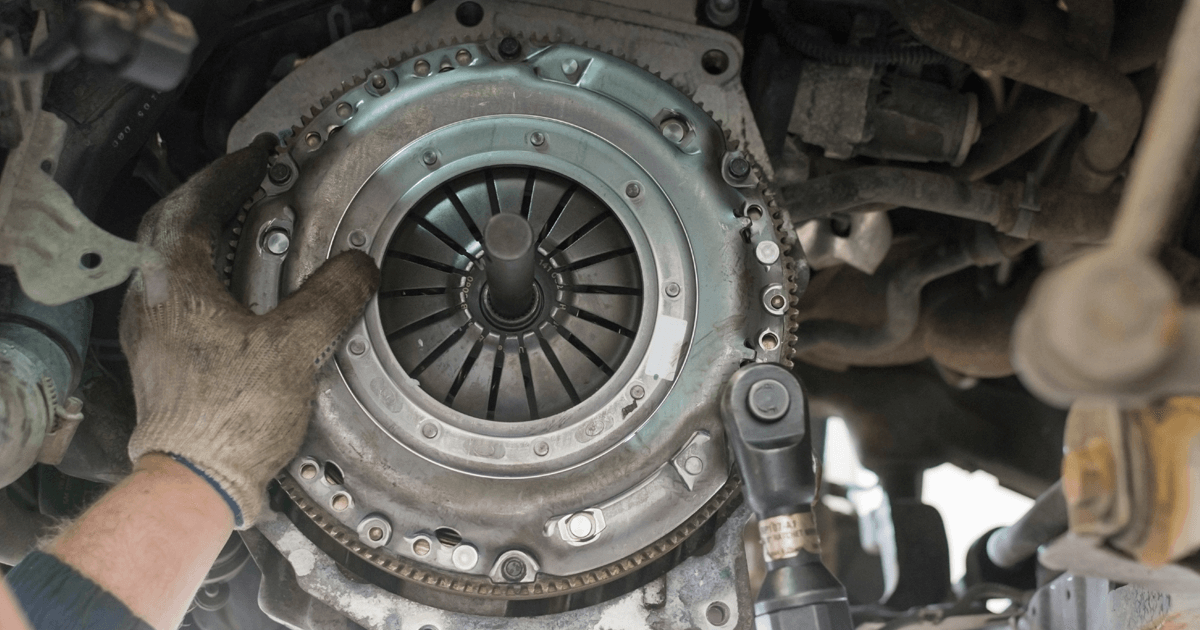 Mechanic is replacing a car clutch