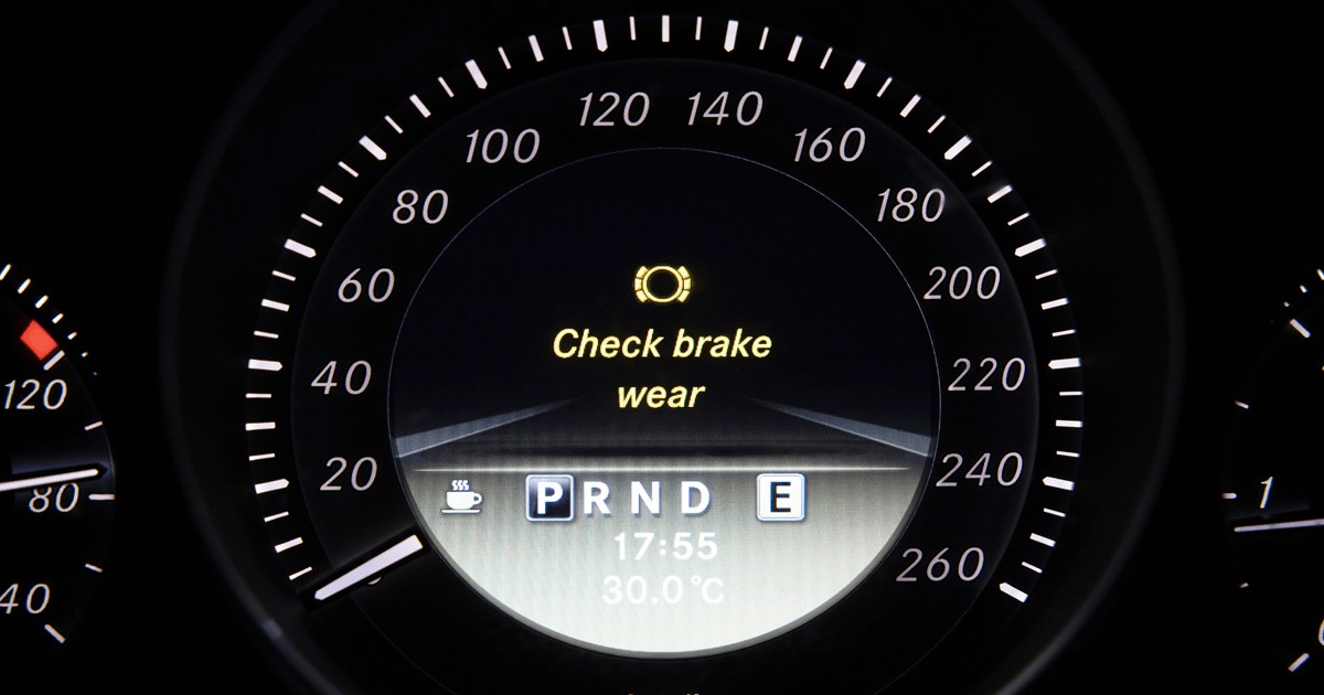 Car brakes, warning sign on a car dashboard - check brake wear